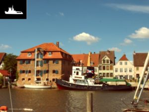 Abbildung 1: Der Tilt-Shift-Fake: Die Schärfe beschränkt sich auf die "Flensburg". Oben links sehen Sie die Auswahl der scharfen Bereiche in Weiß.