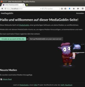 Abbildung 1: Die Benutzeroberfläche von MediaGoblin begrüßt den Anwender in Schwarz und einer Mischung aus Deutsch und Englisch.
