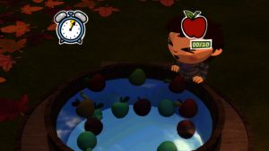 Bei solchen Minispielen kann man sich zusätzliche Süßigkeiten verdienen. Hier muss man unter Zeitdruck die vorgegebene Anzahl Äpfel aus dem Wasser fischen.