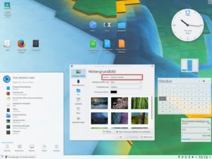 Abbildung 4: In KDE Plasma 5.10 ist wieder die Ordner-Ansicht Standard. Plasmoids wie eine Uhr oder Monitore für CPU-Last und Plattenbelegung teilen sich dabei die Desktop-Fläche mit Startern für Programme.