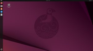 Abbildung 3: Der Ubuntu-Gnome-Desktop weist anders als das Original eine permanent sichtbare Starterleiste samt Startmen&uuml;-Button auf.