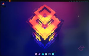 Abbildung 1: Der Desktop des Live-Systems hat einen dunklen Hintergrund. Mit dem Panel oben und dem Dock unten erinnert er an Gnome oder MacOS.